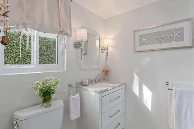 a bed room with a bed and a chair