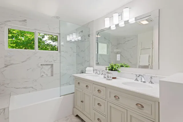 a bed room with a bed and a chandelier