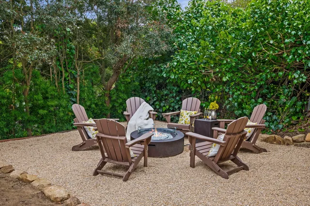 a view of a chairs and table in a patio