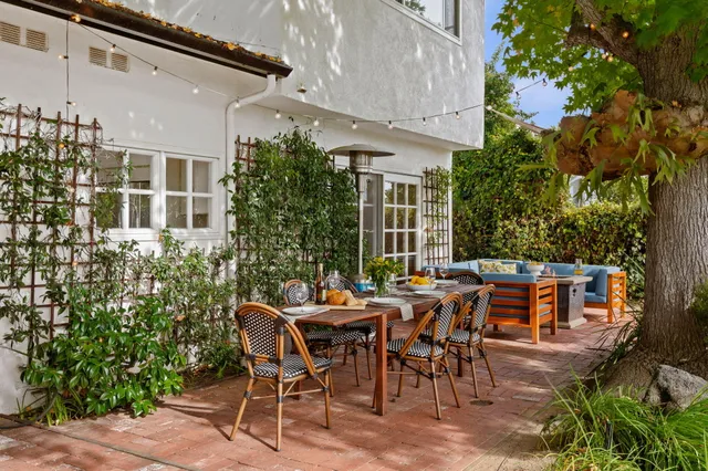 a dining table with a potted plant