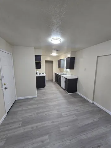 a view of a kitchen with a sink and a microwave