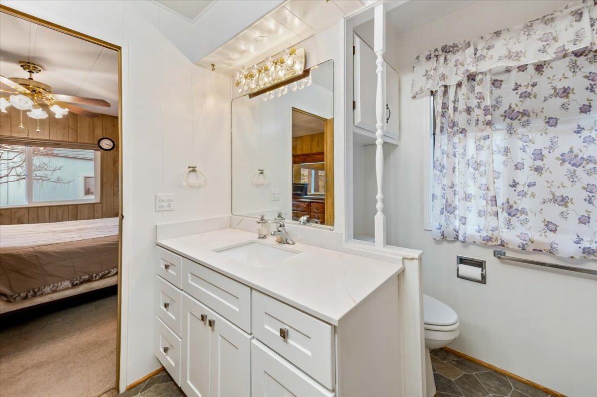 27 Primrose Lane Grass Valley, CA 95945 - Photo 19 of 44 a bathroom with a sink a toilet and shower