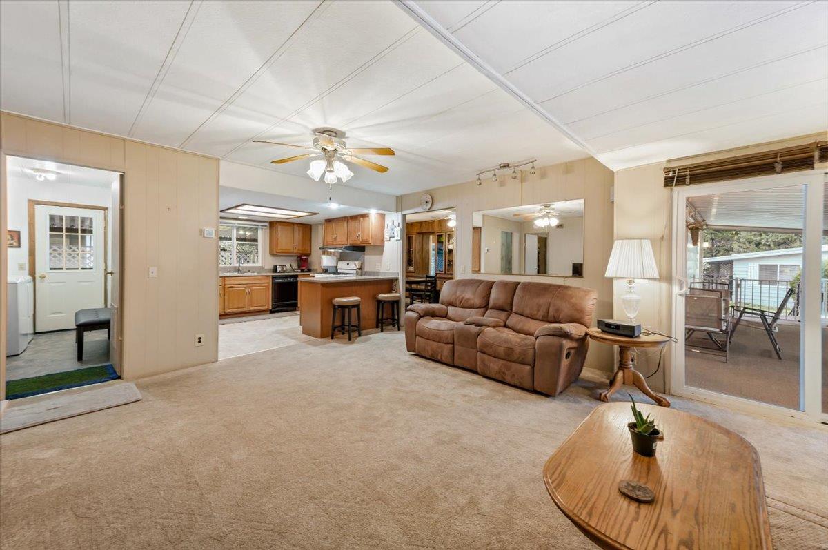 27 Primrose Lane Grass Valley, CA 95945 - Photo 2 of 44 a living room with furniture and a chandelier