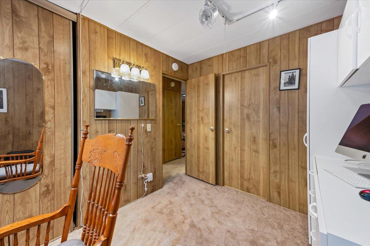 27 Primrose Lane Grass Valley, CA 95945 - Photo 23 of 44 a bedroom with a bed and a mirror