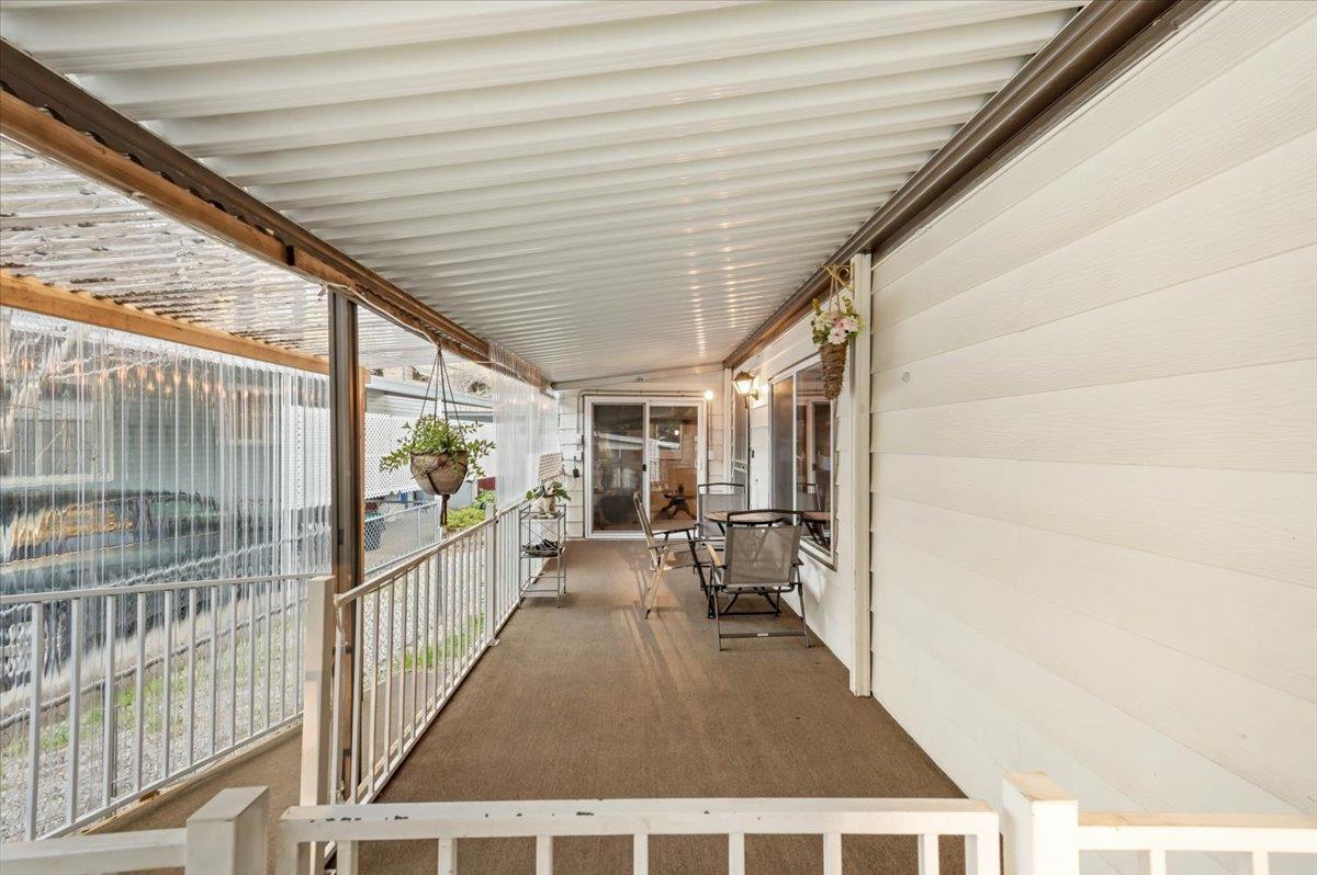 27 Primrose Lane Grass Valley, CA 95945 - Photo 32 of 44 a view of a porch with wooden floor and furniture