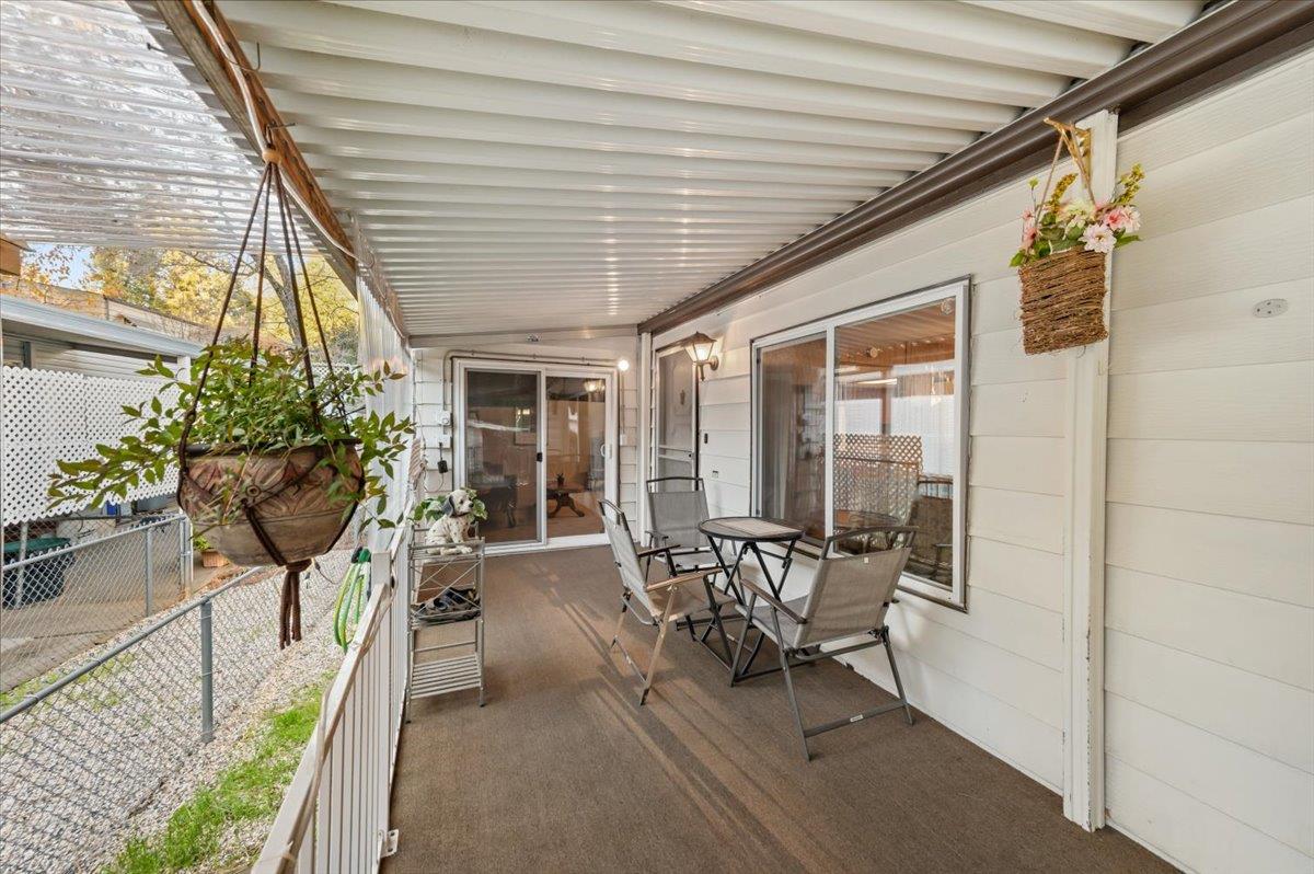 27 Primrose Lane Grass Valley, CA 95945 - Photo 33 of 44 a view of a patio with table and chairs and potted plants
