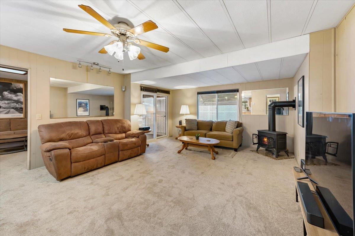 27 Primrose Lane Grass Valley, CA 95945 - Photo 9 of 44 a living room with furniture and a chandelier