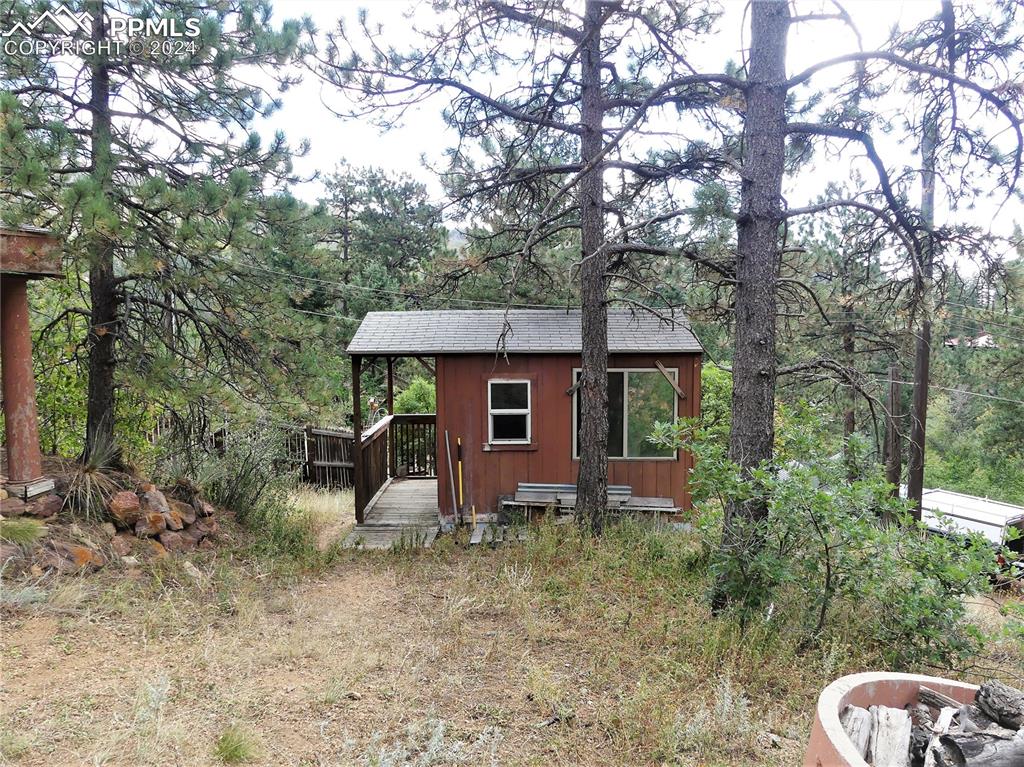 4390 Prairie Street Cascade, CO 80809 - Photo 12 of 18 a view of a house with a yard
