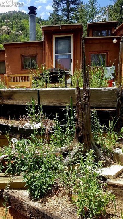 4390 Prairie Street Cascade, CO 80809 - Photo 2 of 18 front view of a house with a yard