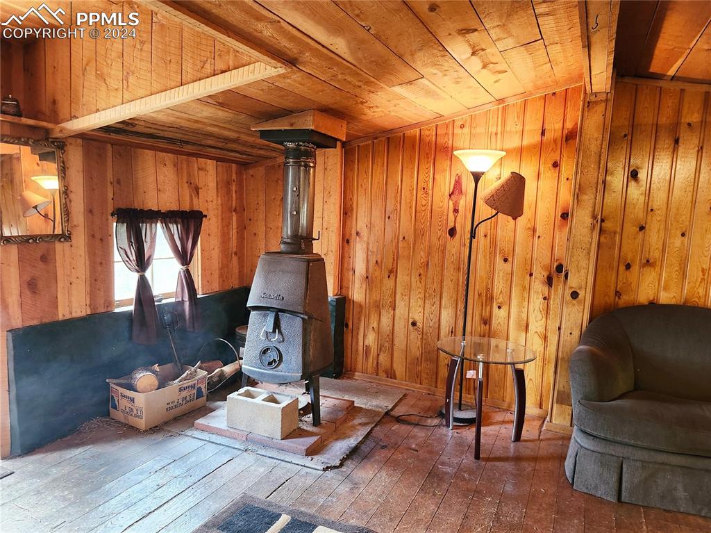 4390 Prairie Street Cascade, CO 80809 - Photo 4 of 18 a living room with furniture and a wooden floor