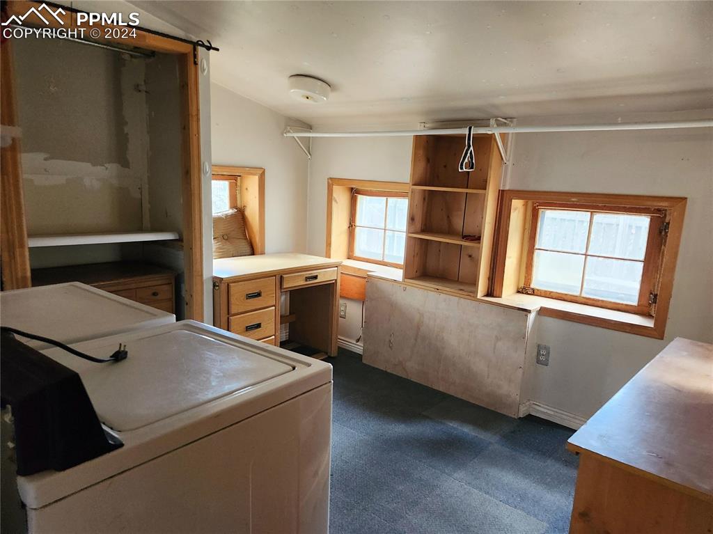 4390 Prairie Street Cascade, CO 80809 - Photo 10 of 18 a kitchen that has a fridge and a stove