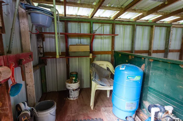 a floor to ceiling window with an outdoor seating