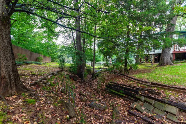 a view of a house with a yard porch and sitting area