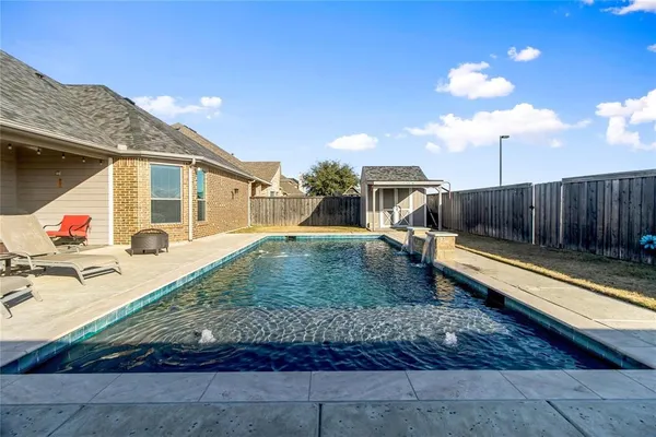 a view of a backyard with a patio