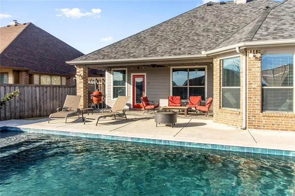 a view of a swimming pool with a lounge chairs