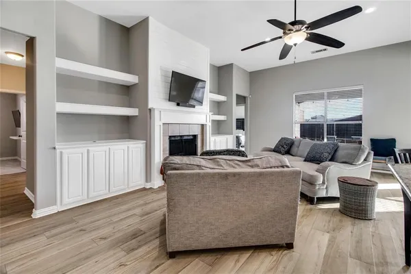 a living room with furniture and a fireplace