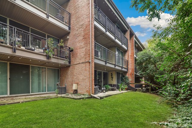 5902 Forest View Road, Unit 2D Lisle, IL 60532 - Photo 1 of 27 a view of a house with a yard and sitting area