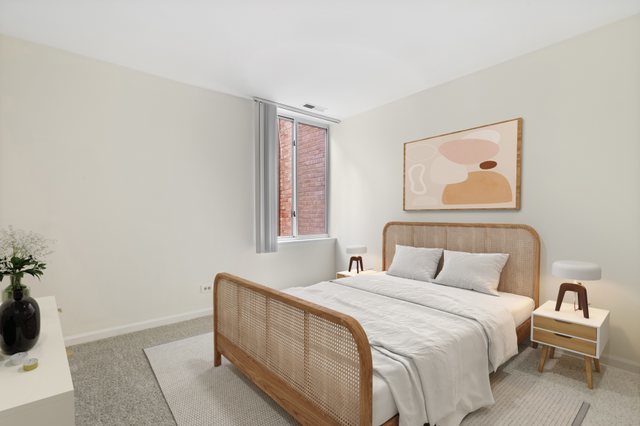 5902 Forest View Road, Unit 2D Lisle, IL 60532 - Photo 14 of 27 a bedroom with a bed and a painting on the wall