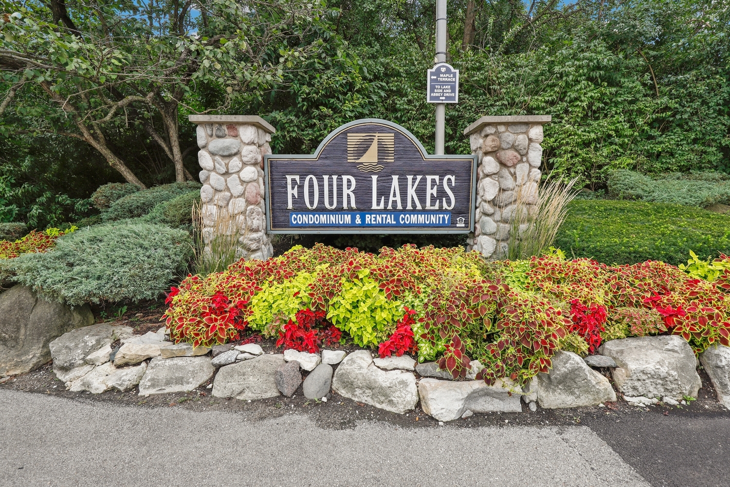 5902 Forest View Road, Unit 2D Lisle, IL 60532 - Photo 20 of 27 a wooden bench sitting in front of a tree
