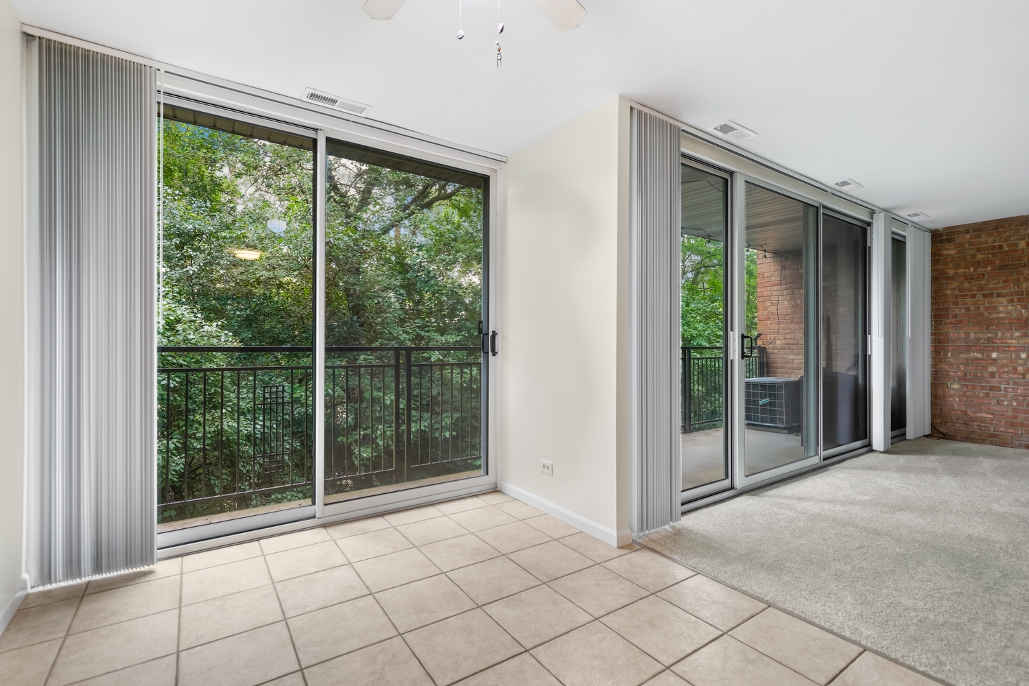 5902 Forest View Road, Unit 2D Lisle, IL 60532 - Photo 5 of 27 a view of a room with sliding glass door and mountain view