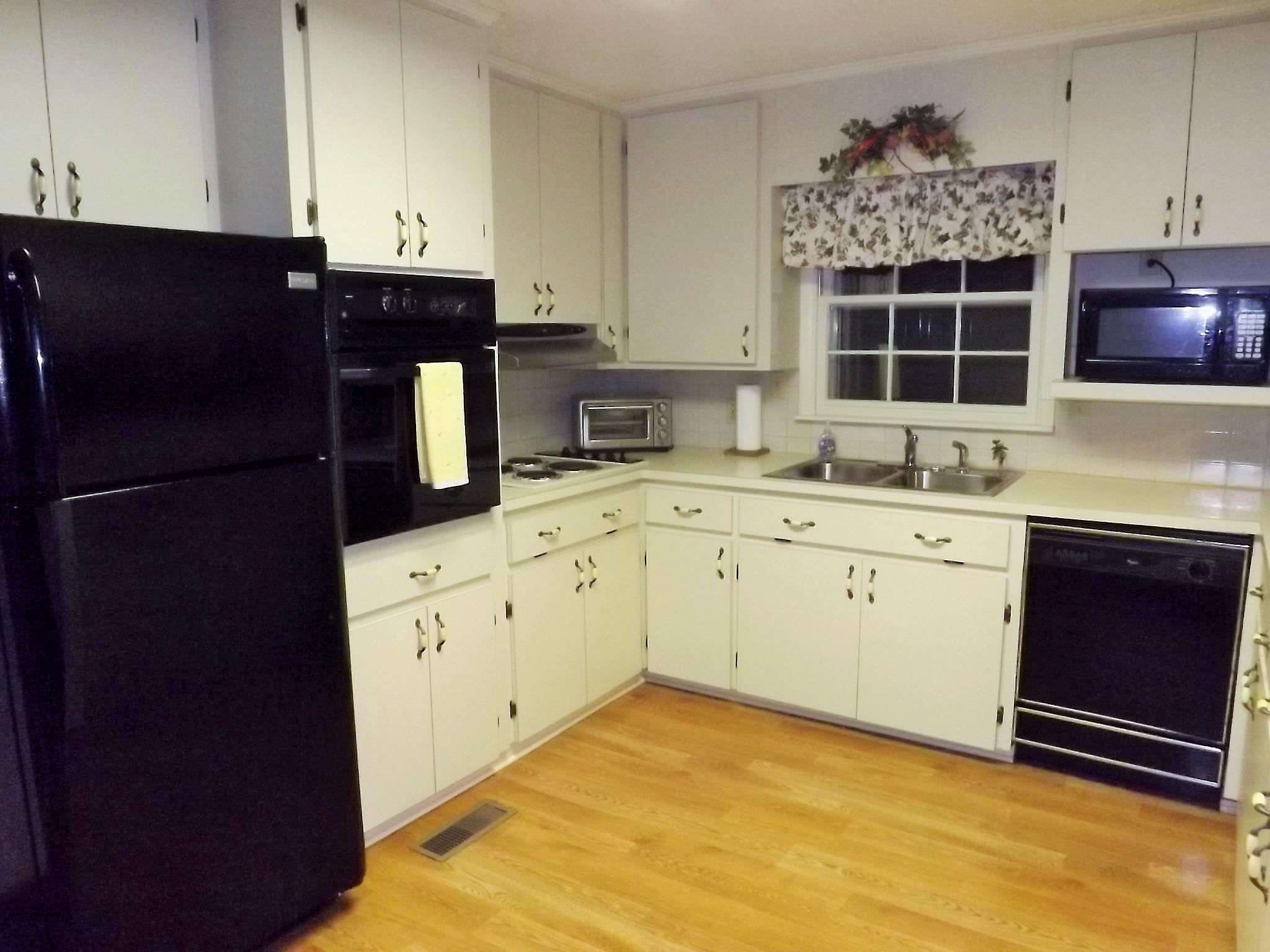 154 Hodge Road Manchester, TN 37355 - Photo 11 of 20 a kitchen with a sink and cabinets