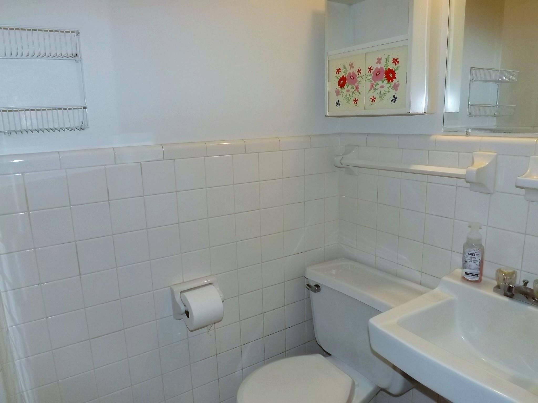 154 Hodge Road Manchester, TN 37355 - Photo 14 of 20 a white toilet sitting next to a bathroom sink