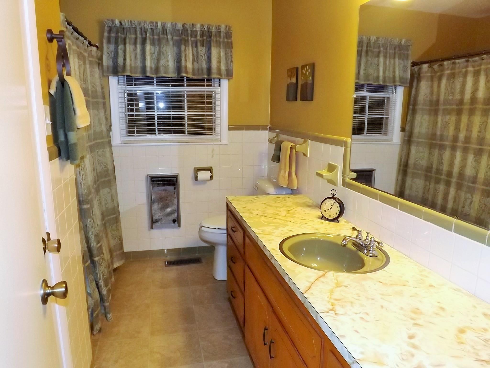 154 Hodge Road Manchester, TN 37355 - Photo 18 of 20 a bathroom with a granite countertop sink a mirror and shower