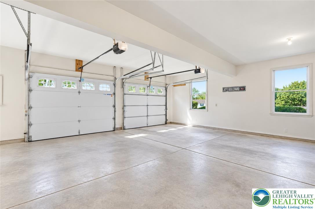 590 Fehr Road Nazareth, PA 18064 - Photo 50 of 79 A spacious multi-car garage features durable concrete flooring and overhead automatic openers.