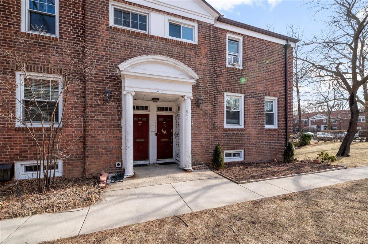 147-51 Charter Road, Unit 23D Queens, NY 11435 - Photo 1 of 1 View of front of house featuring brick siding
