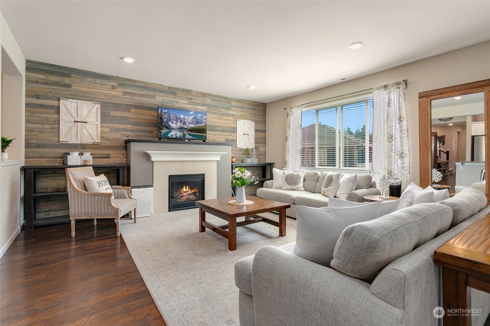 15931 Meridian Avenue South Bothell, WA 98012 - Photo 12 of 40 a living room with furniture and a fireplace
