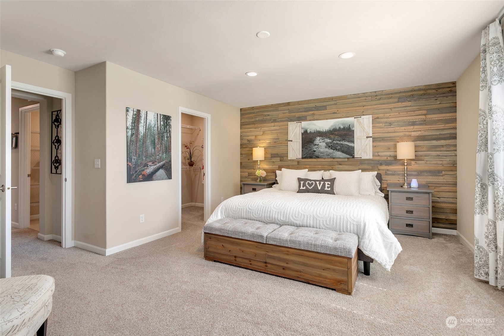 15931 Meridian Avenue South Bothell, WA 98012 - Photo 17 of 40 a spacious bedroom with a bed and glass door