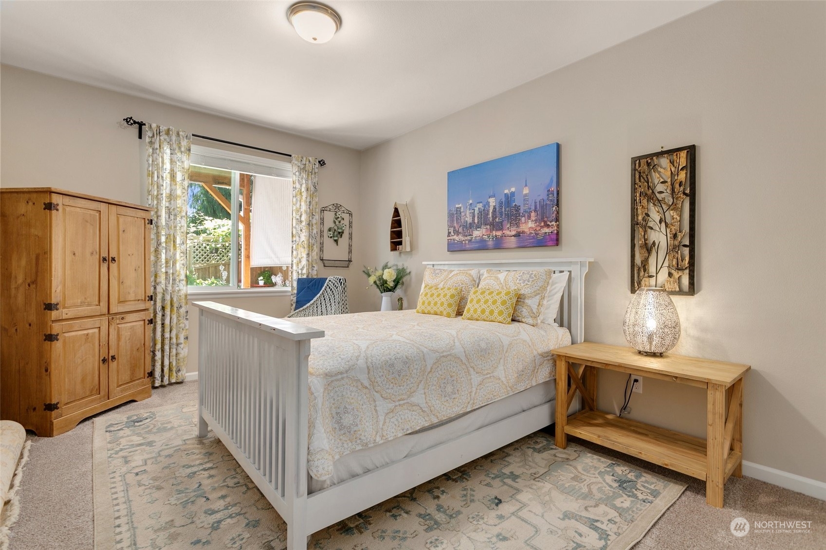 15931 Meridian Avenue South Bothell, WA 98012 - Photo 30 of 40 a bed room with a bed and a painting on the wall