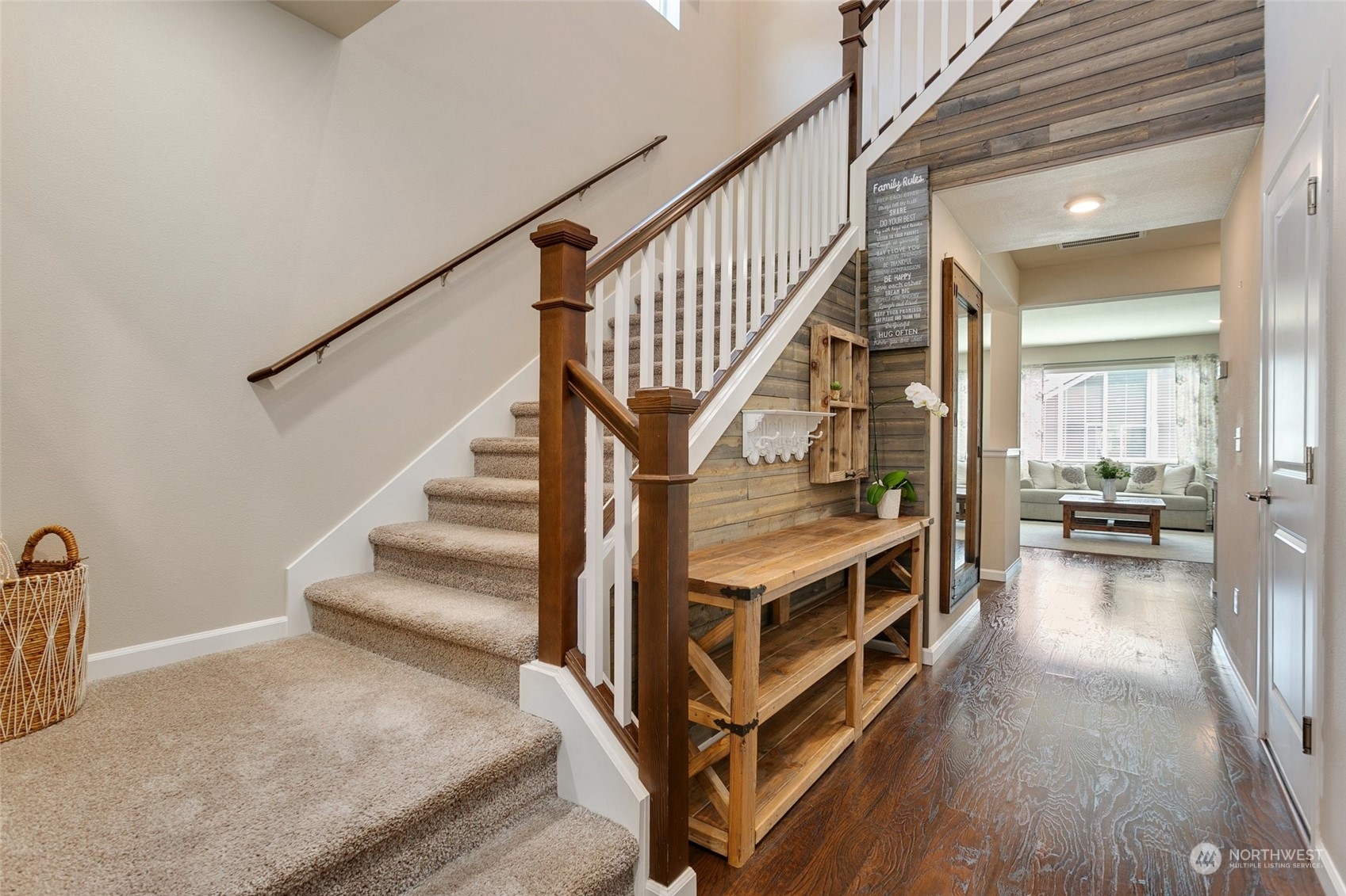 15931 Meridian Avenue South Bothell, WA 98012 - Photo 3 of 40 a view of a hallway with wooden floor and staircase
