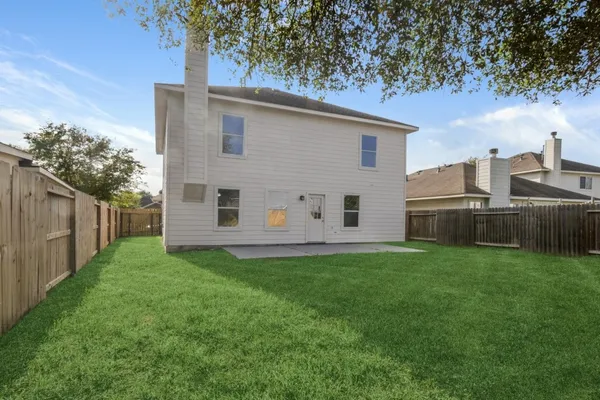 a view of a back yard of the house