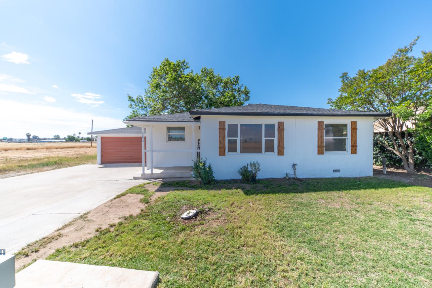 2790 Boles Street Madera, CA 93637 - Photo 1 of 19 a view of a house with backyard and garden