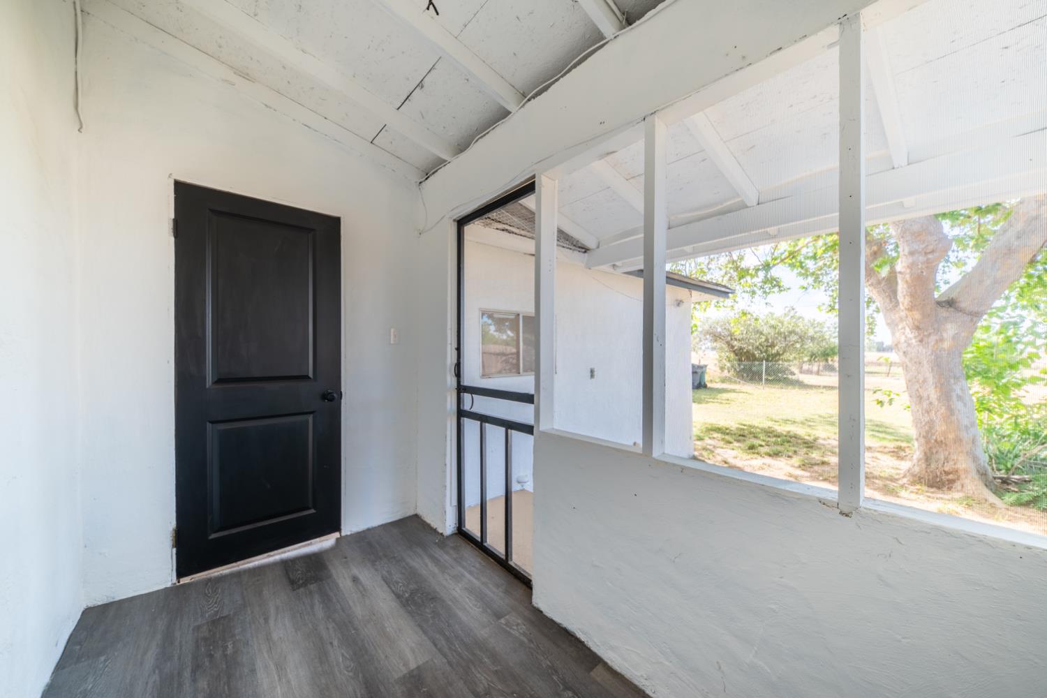 2790 Boles Street Madera, CA 93637 - Photo 17 of 19 an empty room with wooden floor and windows