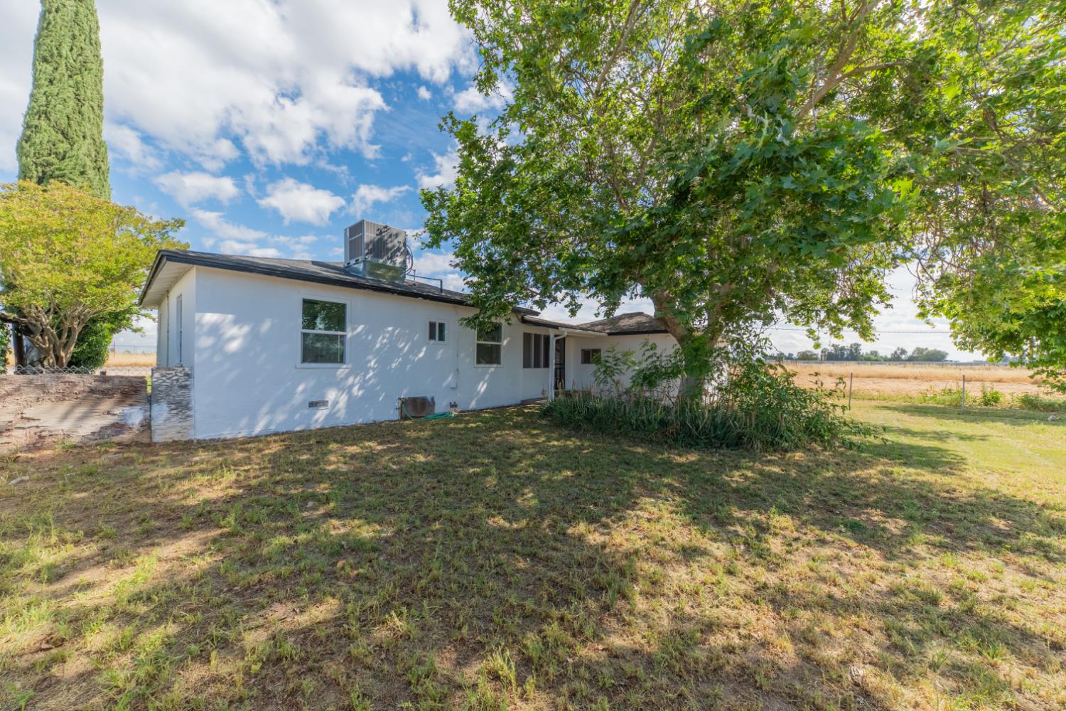 2790 Boles Street Madera, CA 93637 - Photo 18 of 19 a backyard of a house with lots of green space