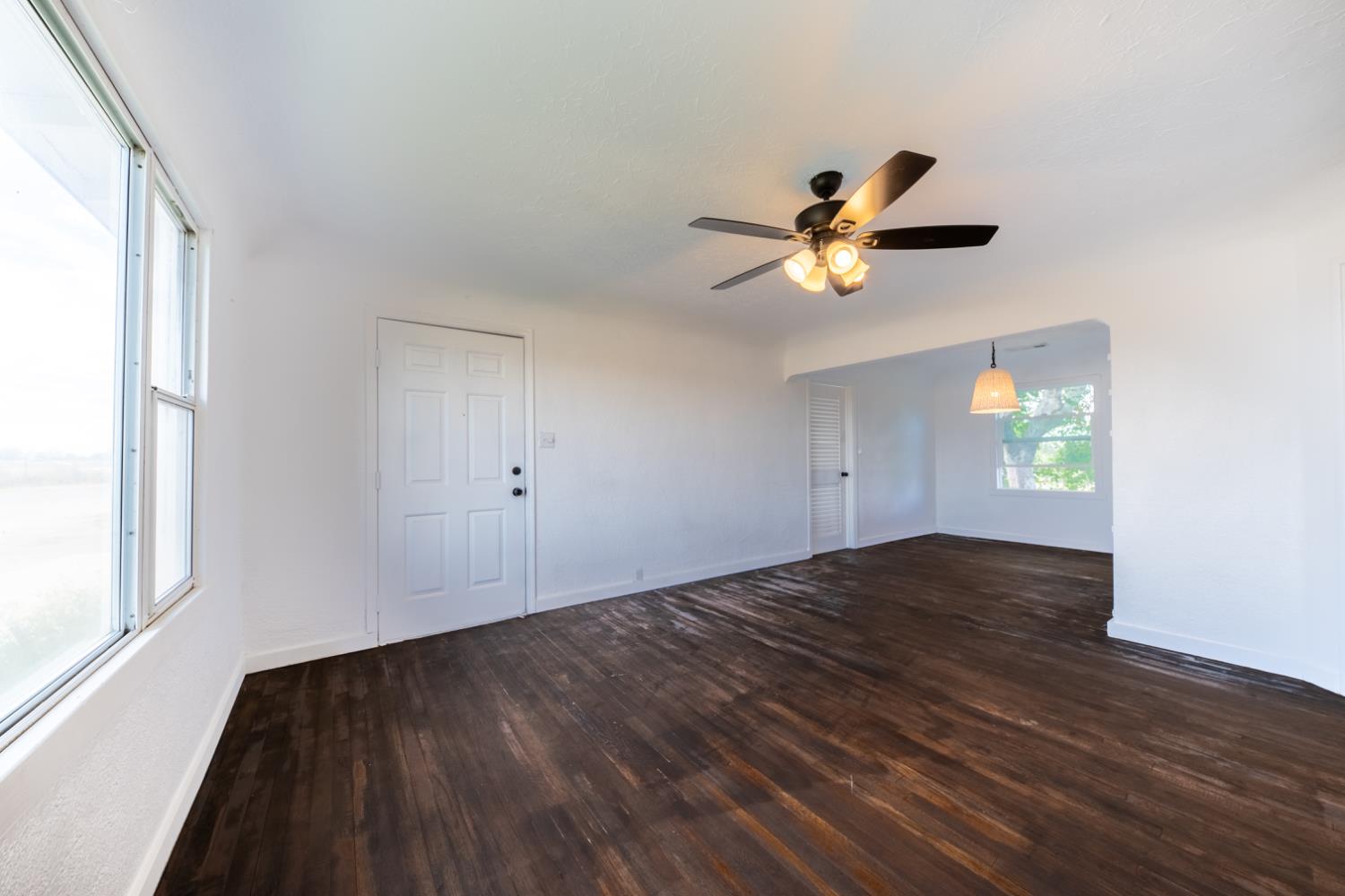 2790 Boles Street Madera, CA 93637 - Photo 5 of 19 a view of an empty room with window and wooden floor