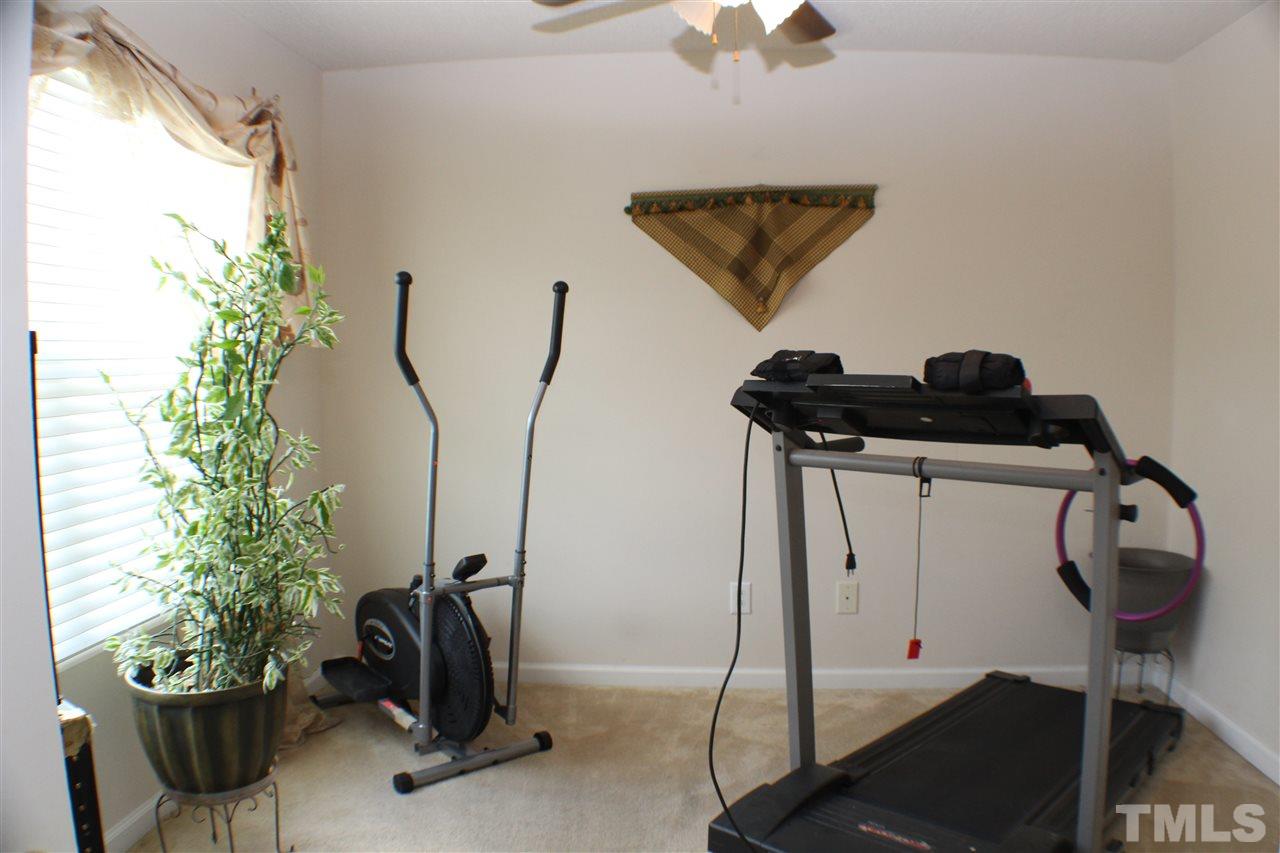 4016 Crowfield Drive Raleigh, NC 27610 - Photo 13 of 20 a view of a room with gym equipment