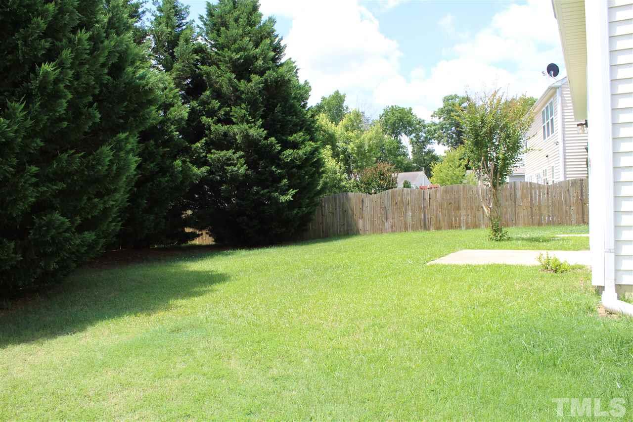 4016 Crowfield Drive Raleigh, NC 27610 - Photo 18 of 20 a view of swimming pool and trees in the background
