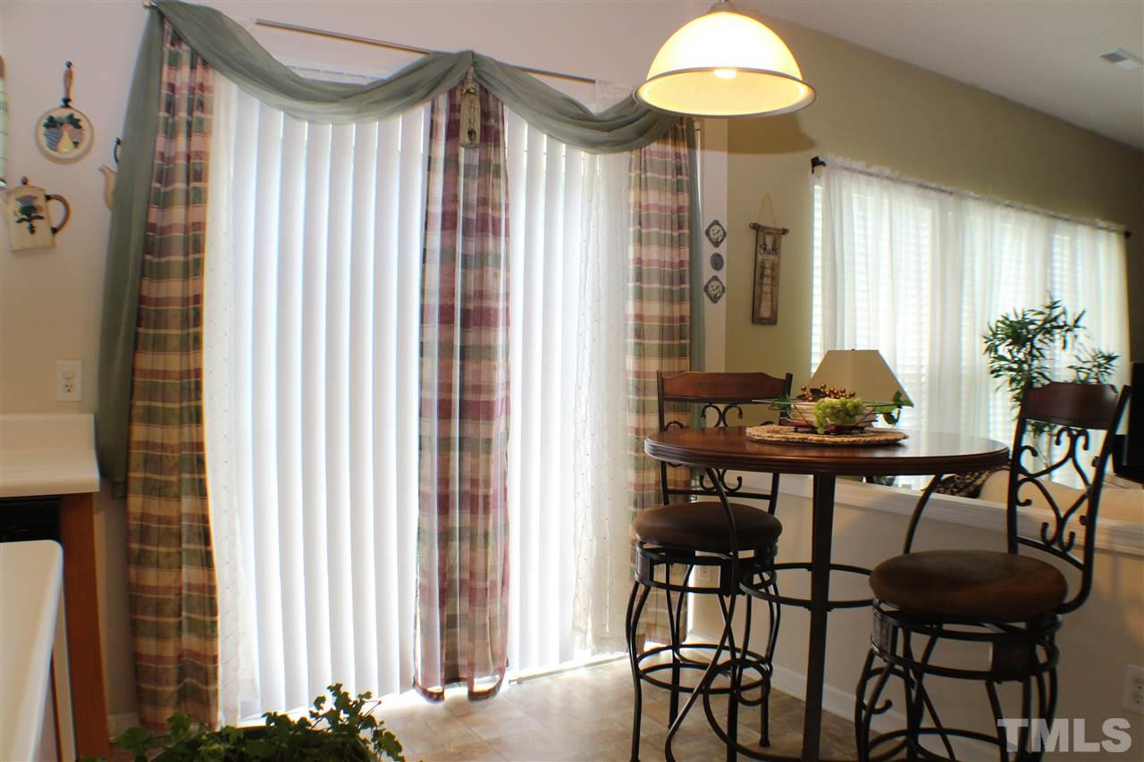 4016 Crowfield Drive Raleigh, NC 27610 - Photo 8 of 20 a dining room with furniture and window