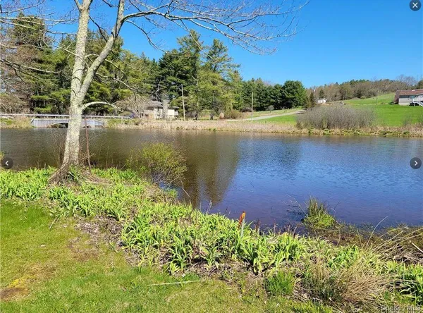 a view of a lake with a house