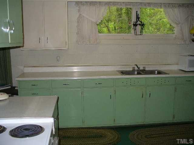 5333 Russell Road Durham, NC 27712 - Photo 11 of 15 a bathroom with a sink and a mirror