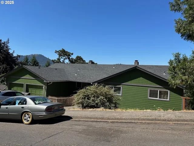a front view of a house with parking space