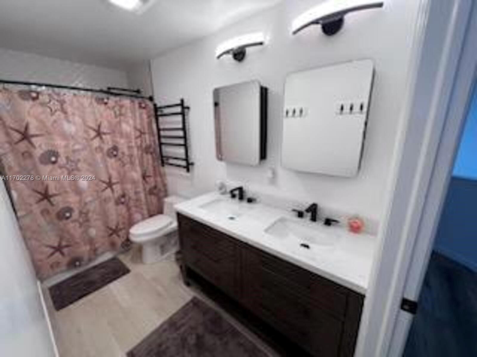 6299 La Costa Drive, Unit D Boca Raton, FL 33433 - Photo 15 of 23 a bathroom with a sink toilet and shower