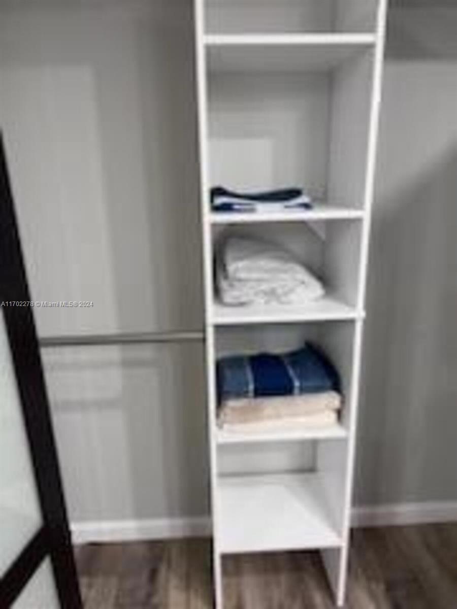 6299 La Costa Drive, Unit D Boca Raton, FL 33433 - Photo 16 of 23 a shelf with cup and table
