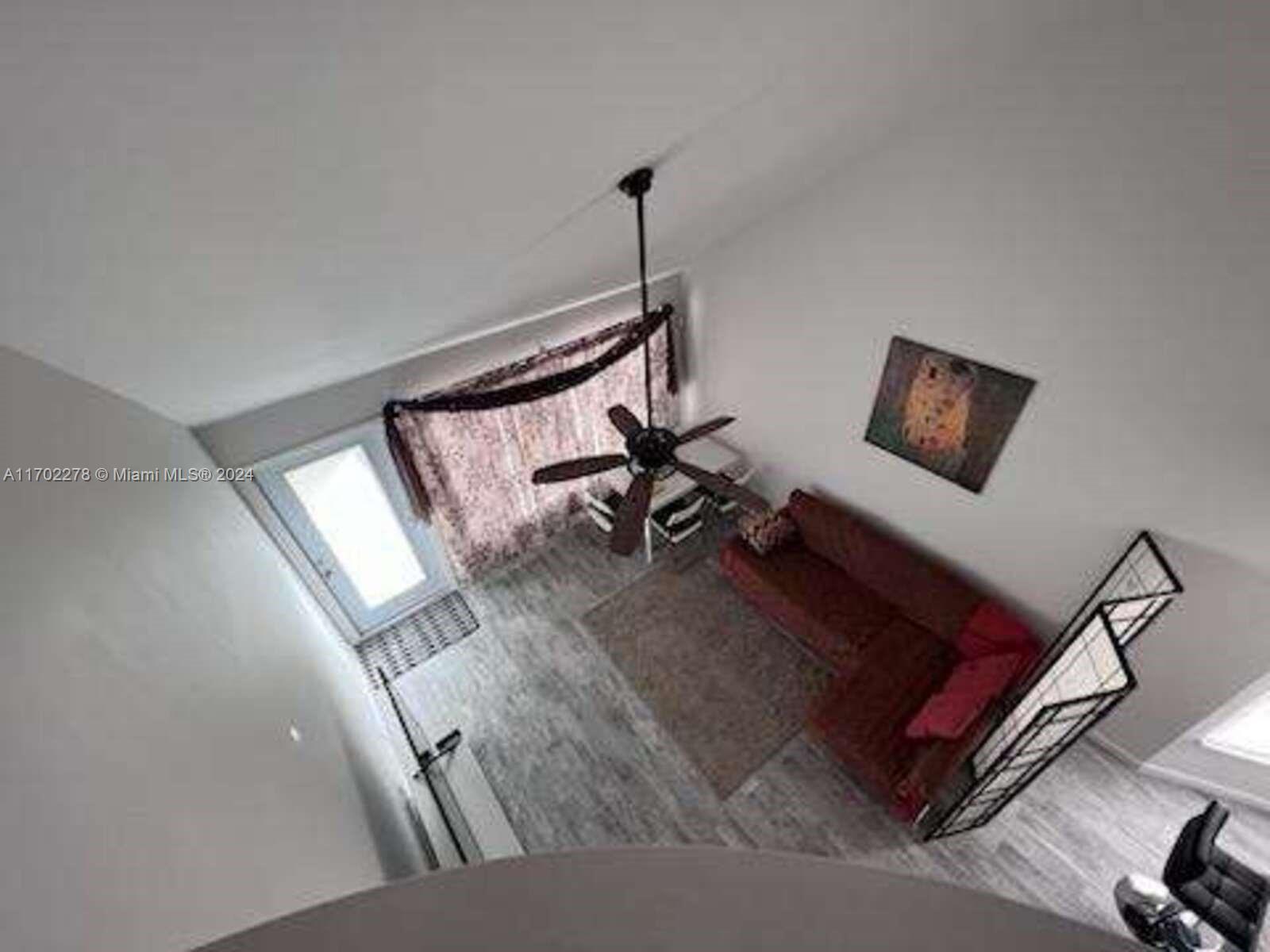 6299 La Costa Drive, Unit D Boca Raton, FL 33433 - Photo 5 of 23 a living room with furniture and a rug