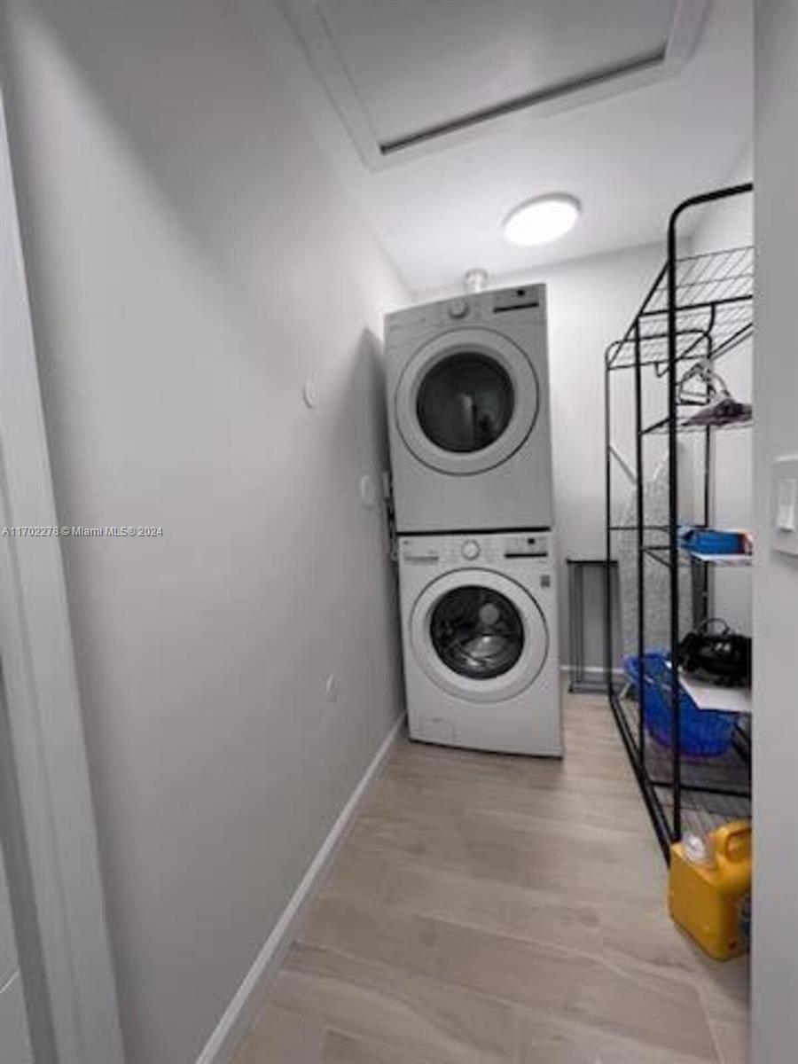 6299 La Costa Drive, Unit D Boca Raton, FL 33433 - Photo 6 of 23 a utility room with dryer and washer