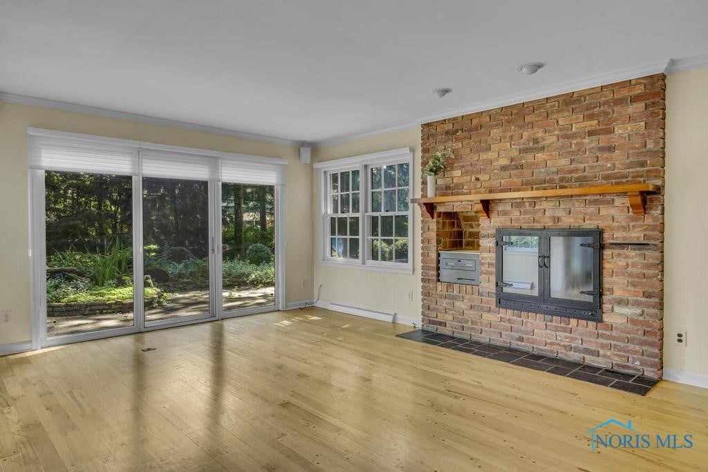 3432 Corey Road Toledo, OH 43615 - Photo 10 of 38 Family room with woodburning fireplace (gas starter)