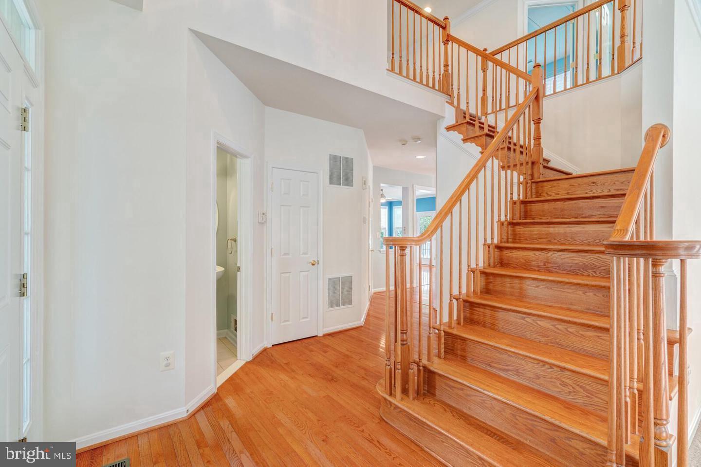 14036 Albert Way Gainesville, VA 20155 - Photo 3 of 35 Front Foyer with all wood staircase to upper level